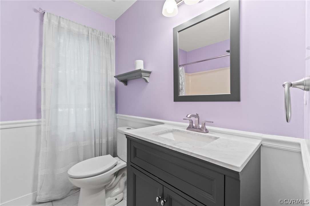 3704 Pease Road Midlothian, VA 23112 - Photo 31 of 50 a bathroom with a sink toilet and mirror