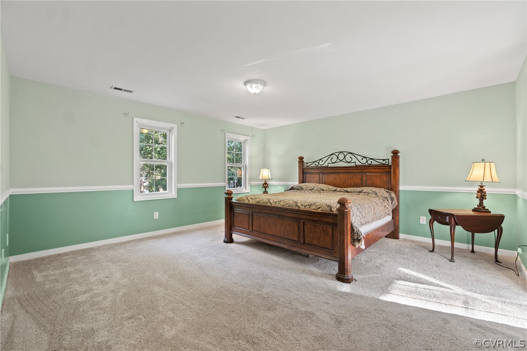 3704 Pease Road Midlothian, VA 23112 - Photo 32 of 50 a bedroom with a bed chair and a window