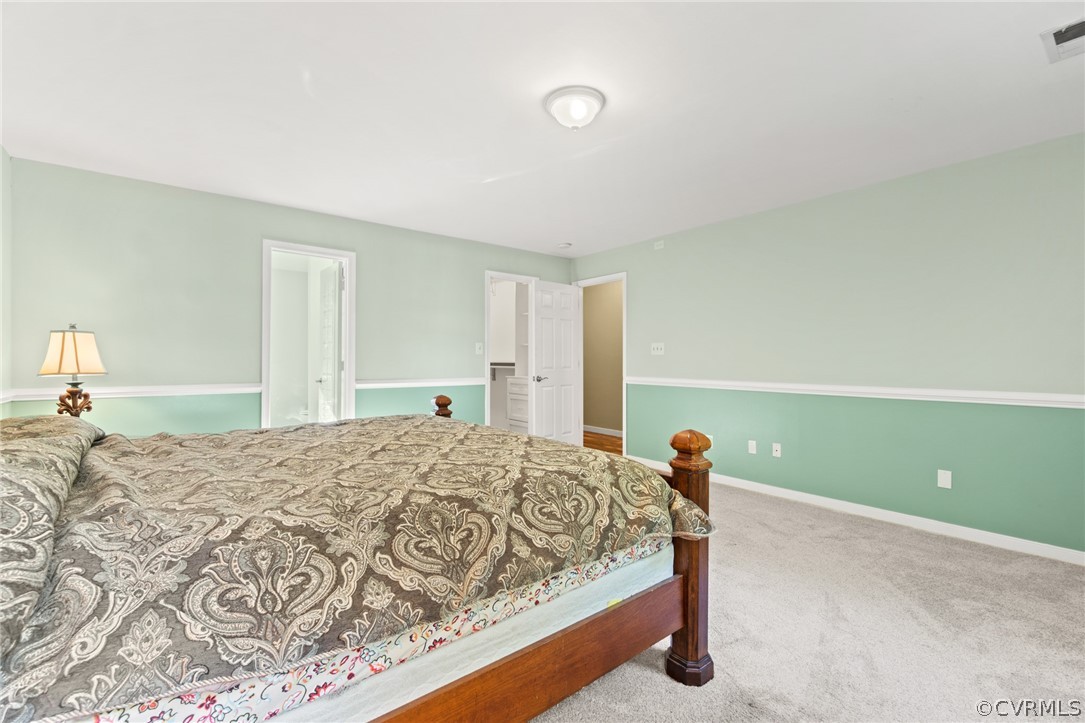 3704 Pease Road Midlothian, VA 23112 - Photo 34 of 50 a bedroom with a bed and a lamp on desk