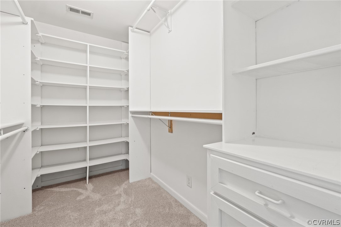 3704 Pease Road Midlothian, VA 23112 - Photo 36 of 50 a view of walk in closet with empty racks