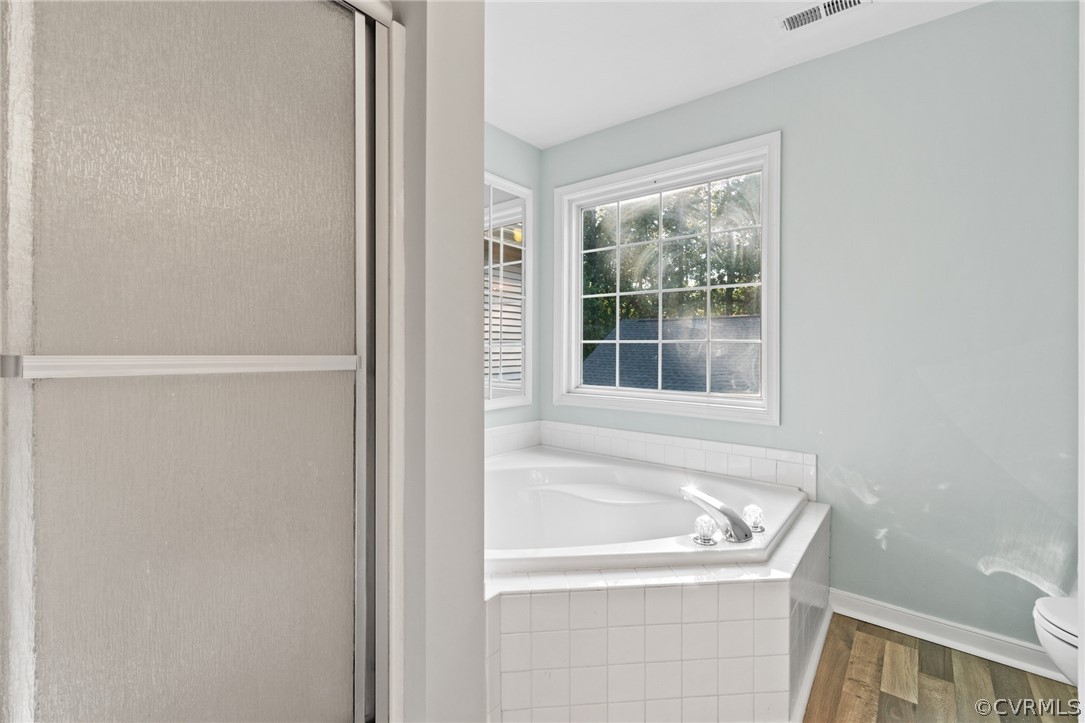 3704 Pease Road Midlothian, VA 23112 - Photo 37 of 50 a white bath tub sitting next to a window
