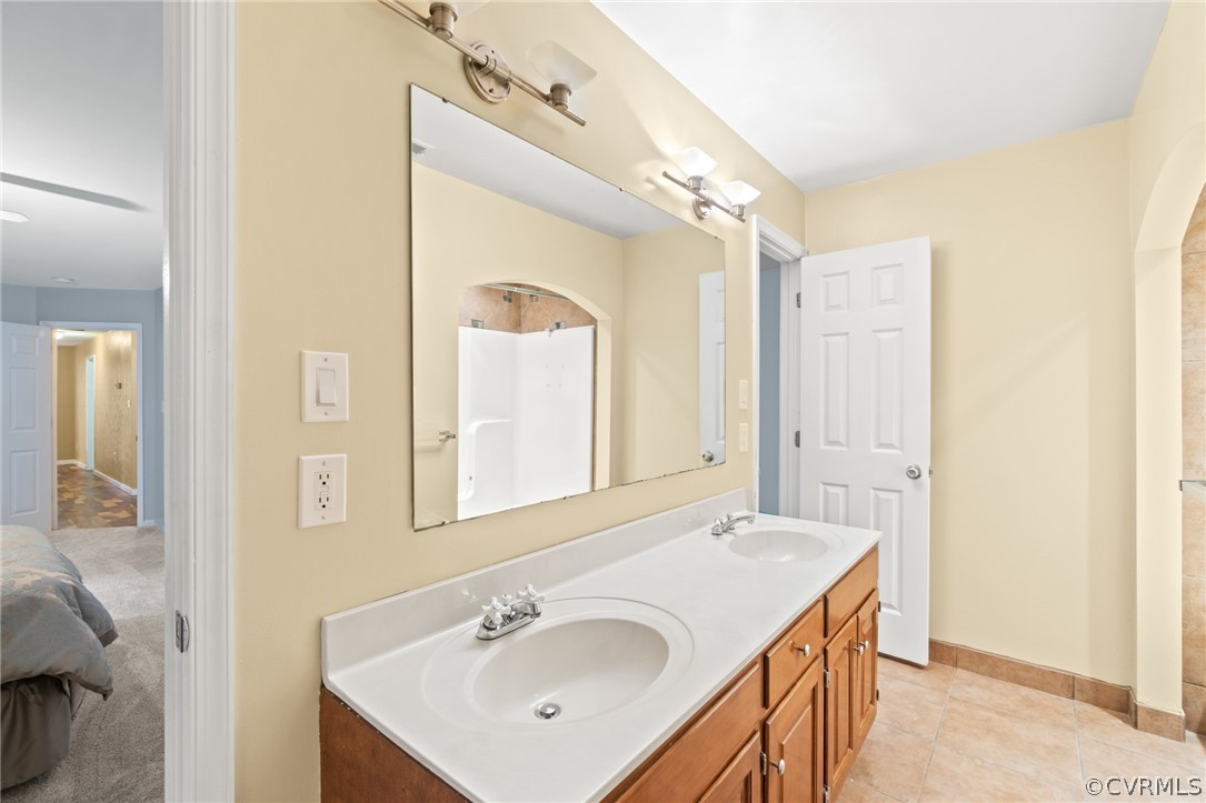 3704 Pease Road Midlothian, VA 23112 - Photo 40 of 50 a bathroom with a sink mirror and vanity
