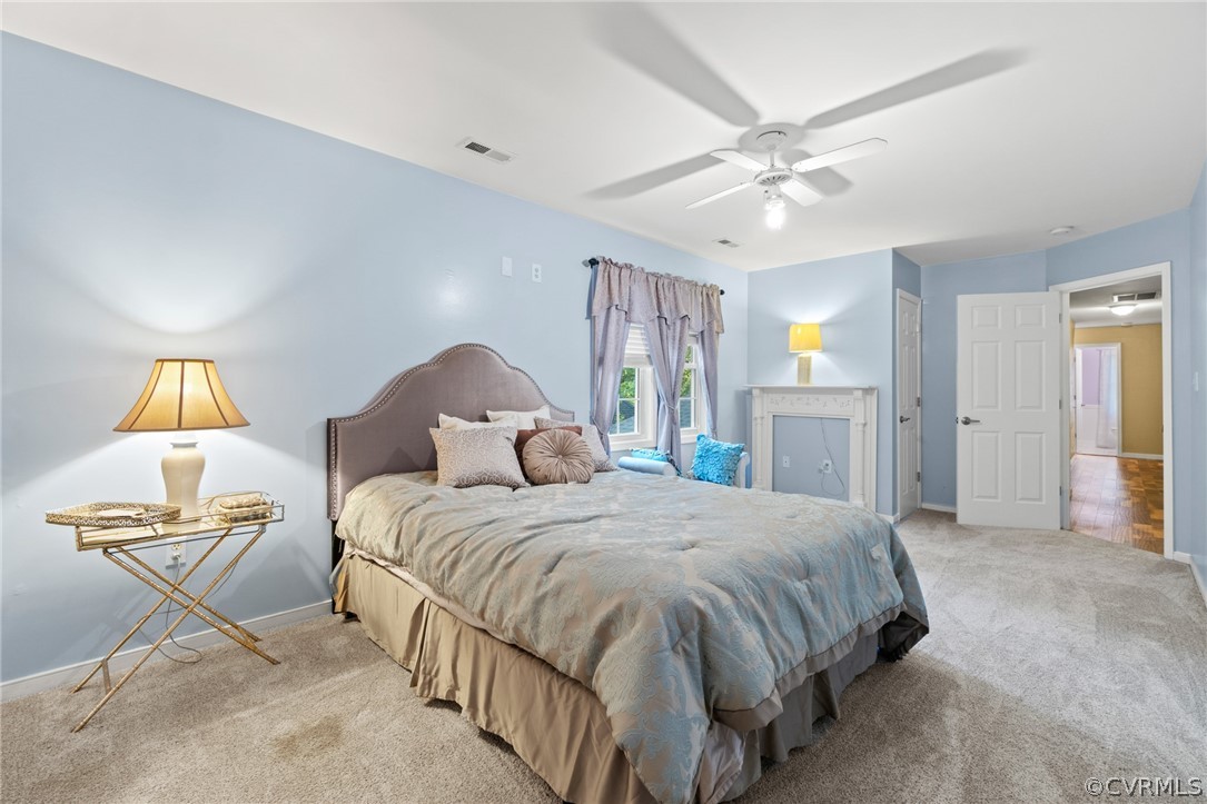 3704 Pease Road Midlothian, VA 23112 - Photo 41 of 50 a bedroom with a bed and a chandelier