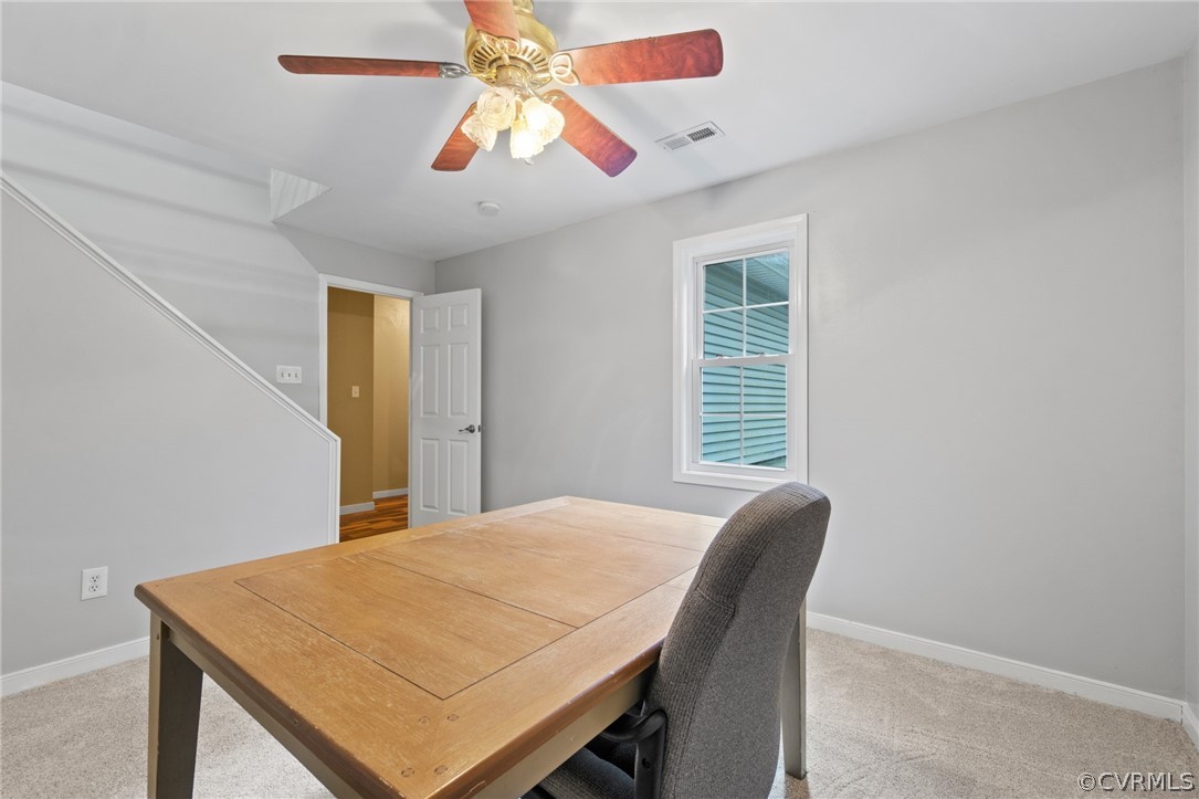 3704 Pease Road Midlothian, VA 23112 - Photo 44 of 50 a view of a dining room with a table and chairs