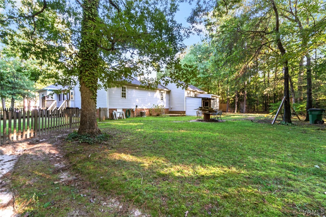 3704 Pease Road Midlothian, VA 23112 - Photo 49 of 50 a view of a house with backyard and a tree