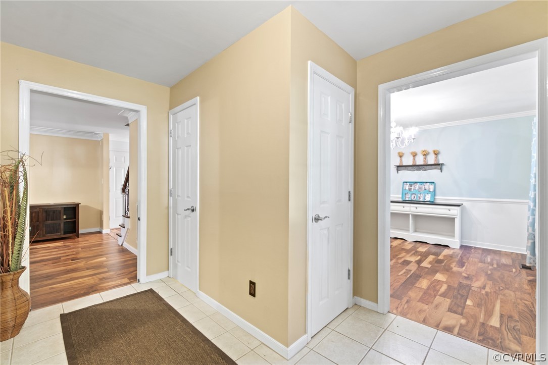 3704 Pease Road Midlothian, VA 23112 - Photo 5 of 50 a view of a hallway with wooden floor and a living room