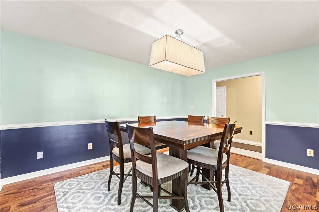 3704 Pease Road Midlothian, VA 23112 - Photo 7 of 50 a view of a dining room with furniture and wooden floor