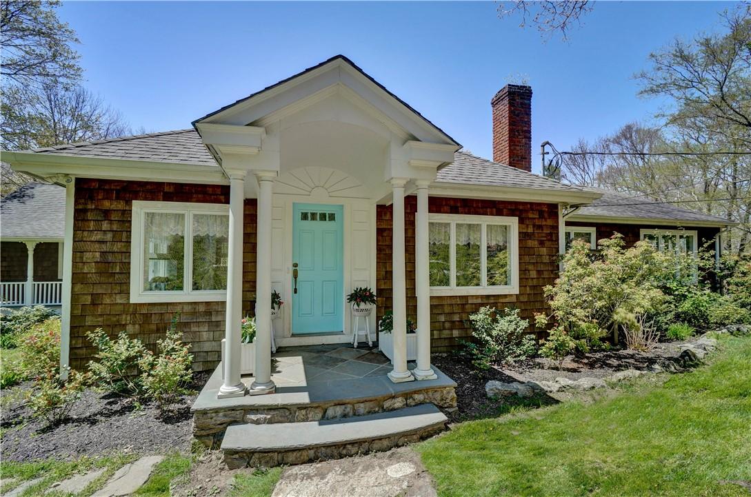 64 Dingee Road Pound Ridge, NY 10576 - Photo 1 of 1 a front view of a house with garden