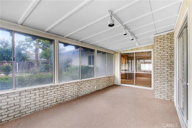 a view of an empty room with a balcony