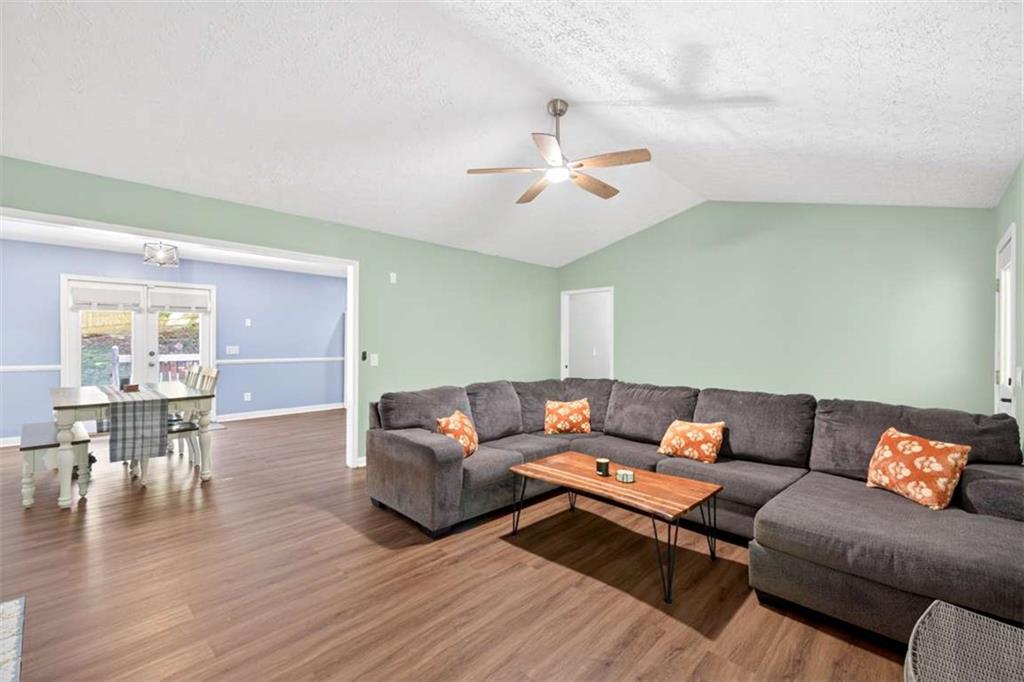 386 Ridgewood Drive Pendergrass, GA 30567 - Photo 7 of 50 a living room with furniture and wooden floor
