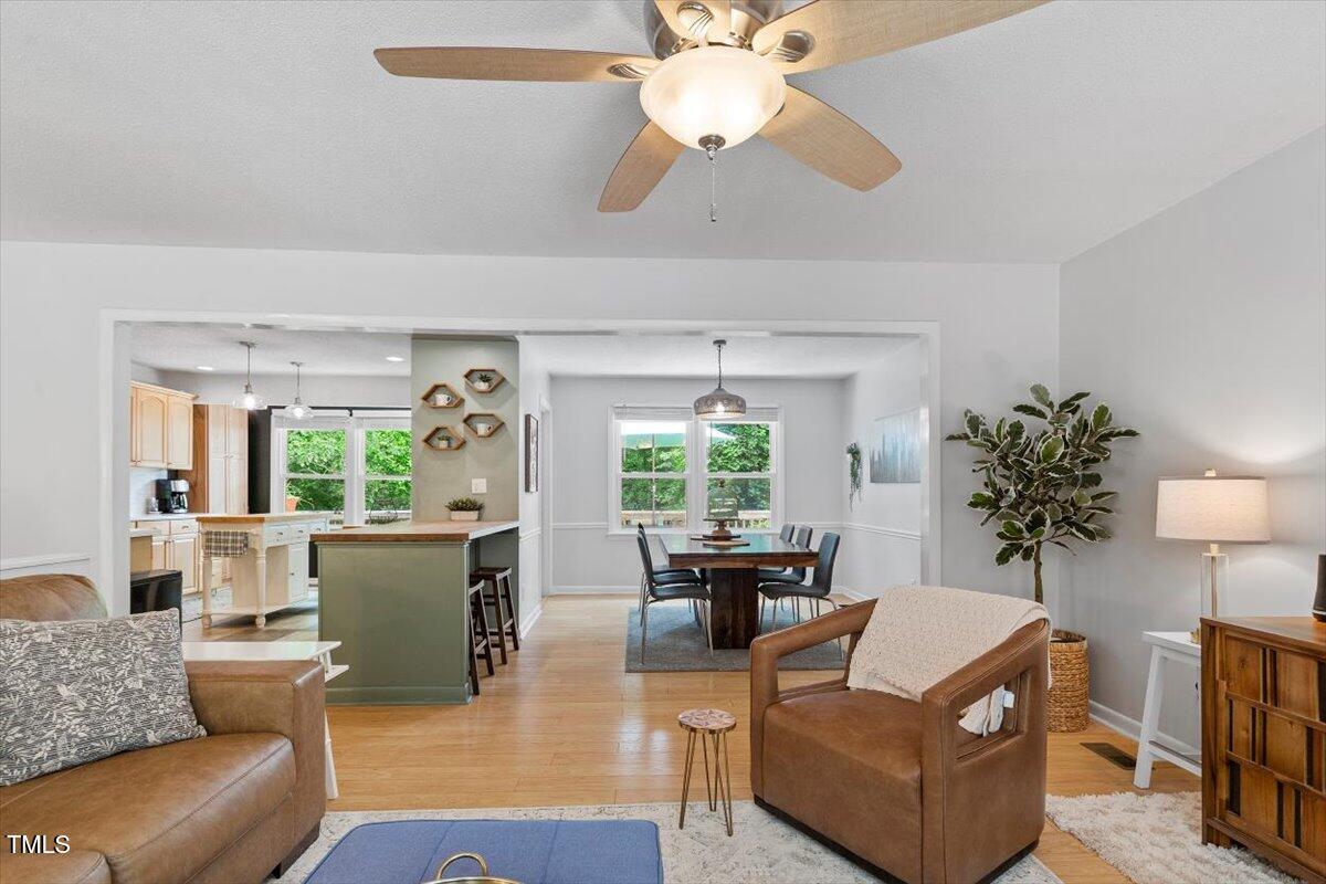 4404 Oak Park Road Raleigh, NC 27612 - Photo 6 of 50 a living room with furniture and a large window
