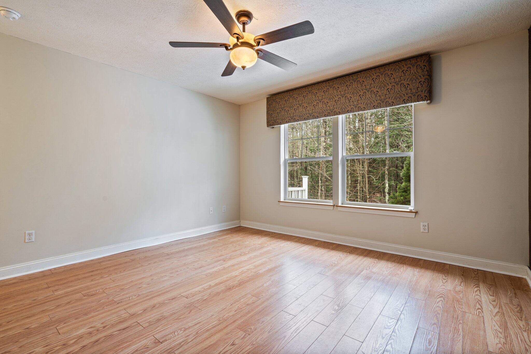 20 Kavanaugh Road, Unit 20 Old Orchard Beach, ME 04064 - Photo 21 of 37 Primary bedroom with hardwood floors