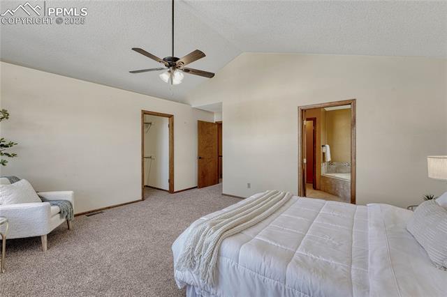 2135 Springcrest Road Colorado Springs, CO 80920 - Photo 28 of 48 Spacious primary bedroom easily fits a King size bed!