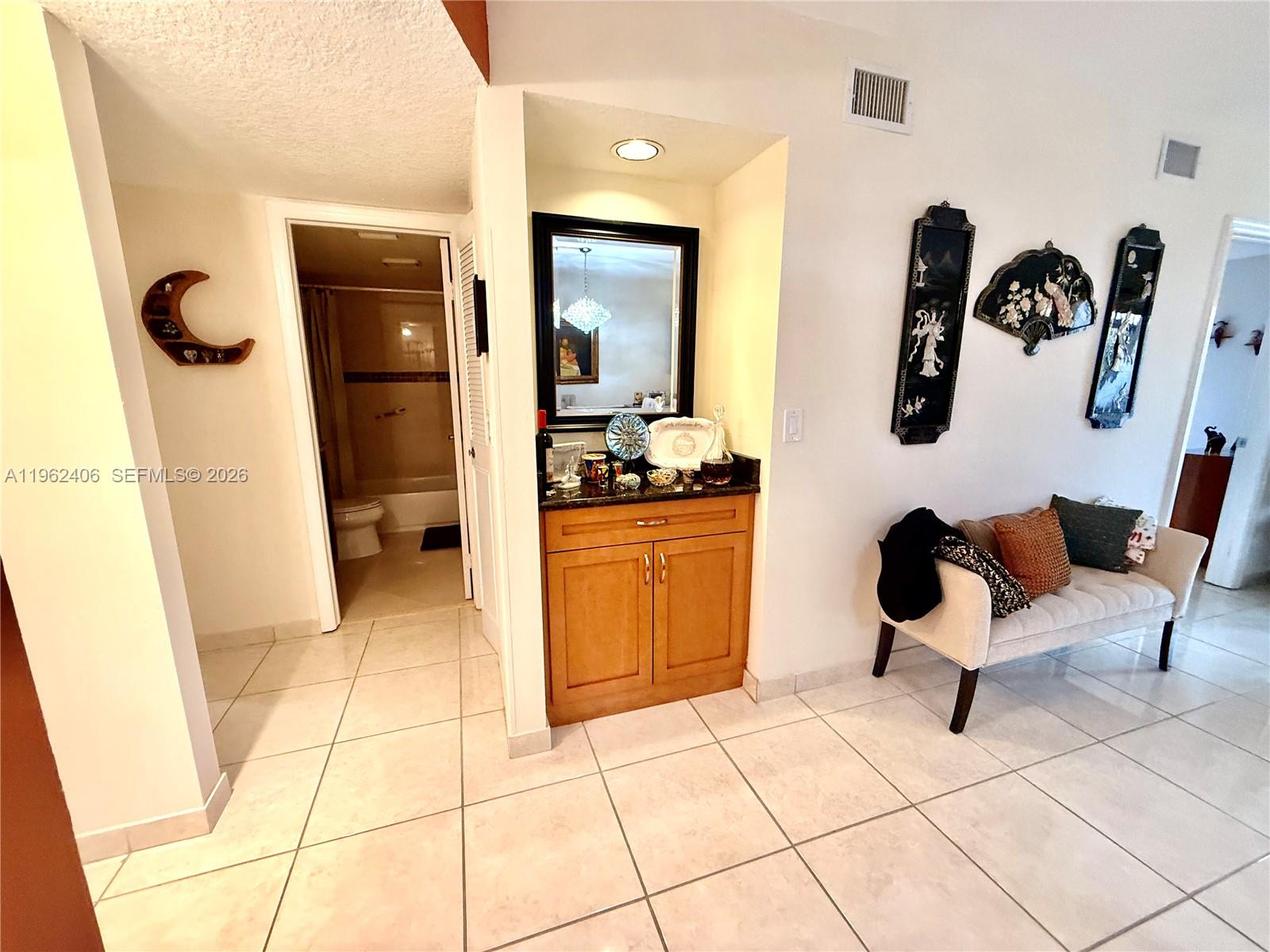351 Club Circle, Unit 102 Boca Raton, FL 33487 - Photo 13 of 34 a kitchen with a sink and a stove top oven