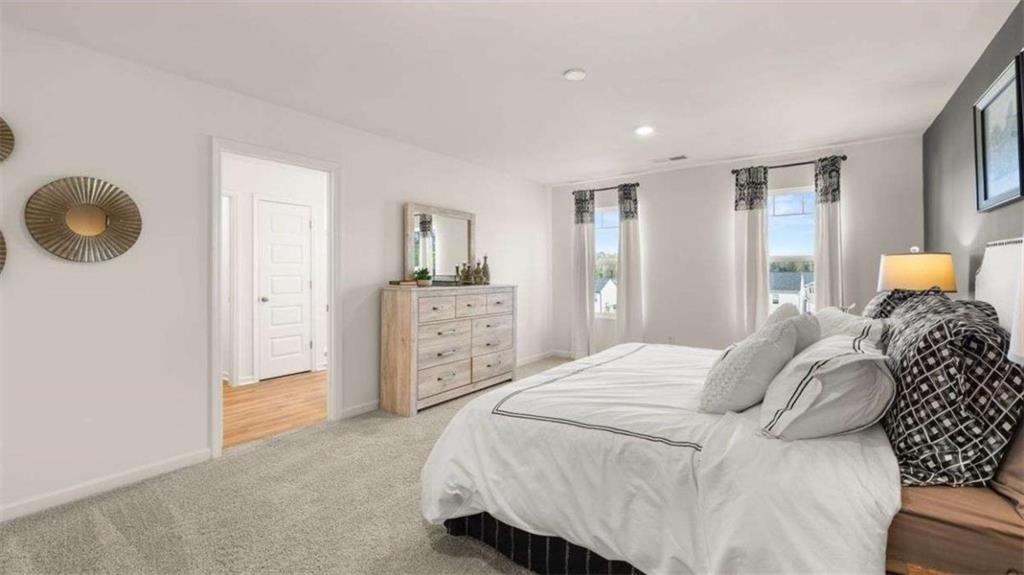 62 White Spruce Way Newnan, GA 30265 - Photo 29 of 41 a bedroom with a bed and cabinets