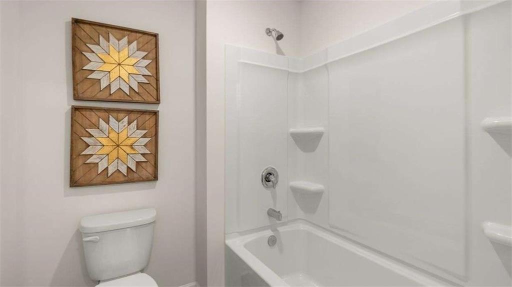 62 White Spruce Way Newnan, GA 30265 - Photo 33 of 41 a bathroom with a bathtub and shower