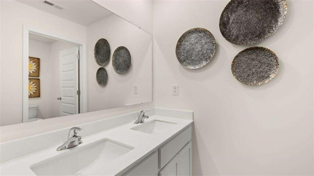 62 White Spruce Way Newnan, GA 30265 - Photo 34 of 41 a bathroom with a sink and a mirror