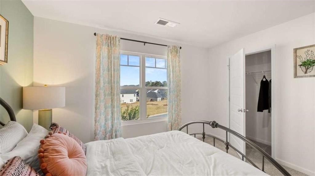 62 White Spruce Way Newnan, GA 30265 - Photo 39 of 41 a bedroom with a bed and a window