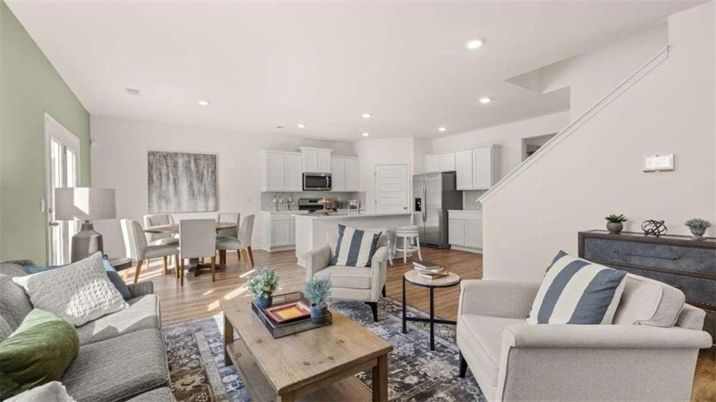 62 White Spruce Way Newnan, GA 30265 - Photo 5 of 41 a living room with furniture and kitchen view