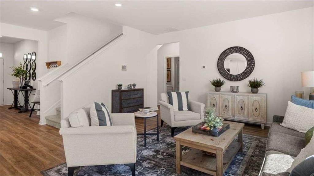 62 White Spruce Way Newnan, GA 30265 - Photo 8 of 41 a living room with furniture and a mirror