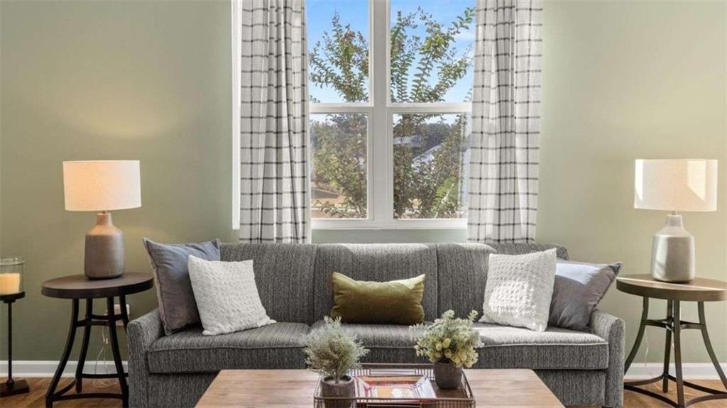 62 White Spruce Way Newnan, GA 30265 - Photo 9 of 41 a living room with furniture and a window