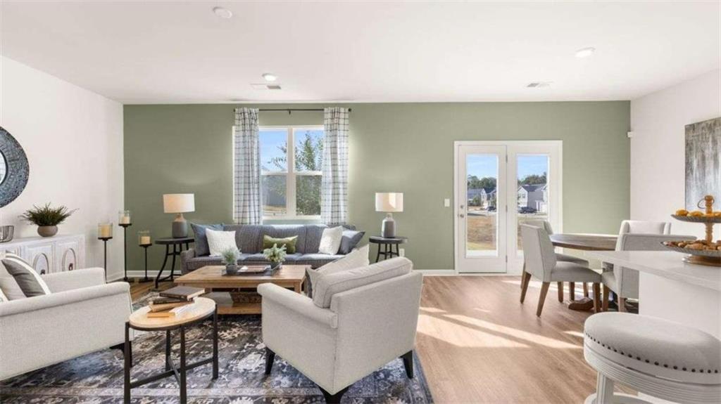 62 White Spruce Way Newnan, GA 30265 - Photo 10 of 41 a living room with furniture and a large window