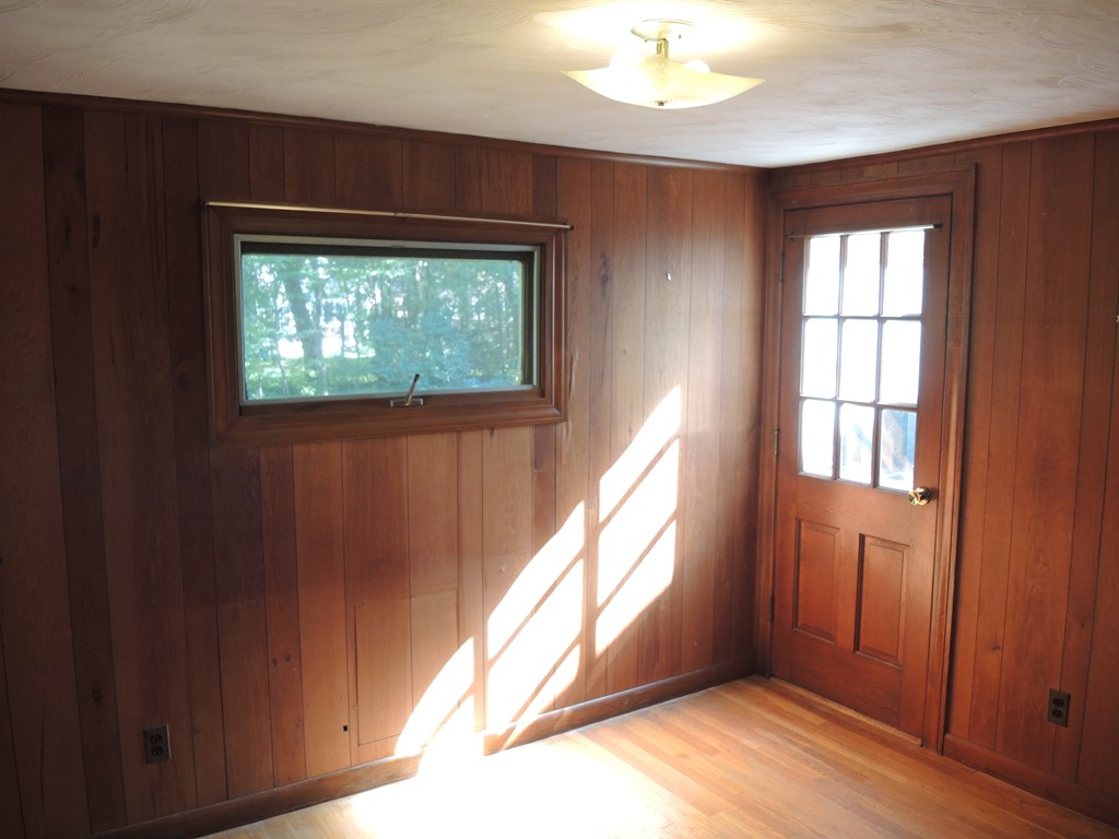 58 Avalon Road Needham, MA 02492 - Photo 11 of 22 a view of an empty room with wooden floor and windows