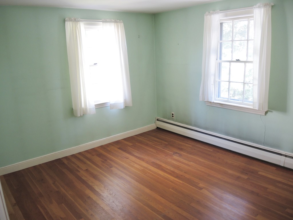 58 Avalon Road Needham, MA 02492 - Photo 13 of 22 an empty room with wooden floor and windows