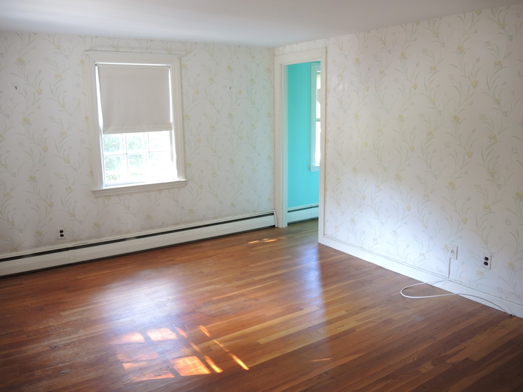 58 Avalon Road Needham, MA 02492 - Photo 15 of 22 an empty room with wooden floor and windows