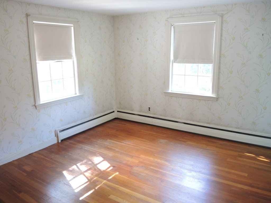 58 Avalon Road Needham, MA 02492 - Photo 16 of 22 an empty room with wooden floor and windows
