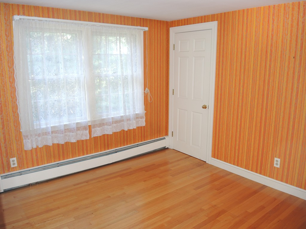 58 Avalon Road Needham, MA 02492 - Photo 17 of 22 a view of an empty room with wooden floor and a window