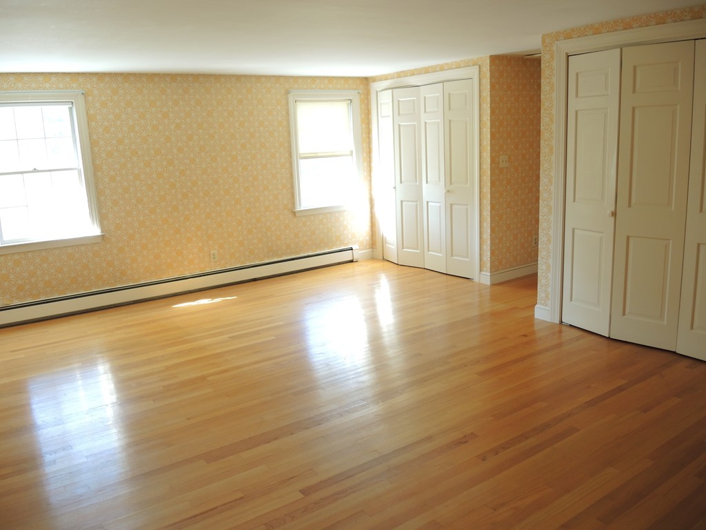 58 Avalon Road Needham, MA 02492 - Photo 19 of 22 a view of an empty room with wooden floor and a window