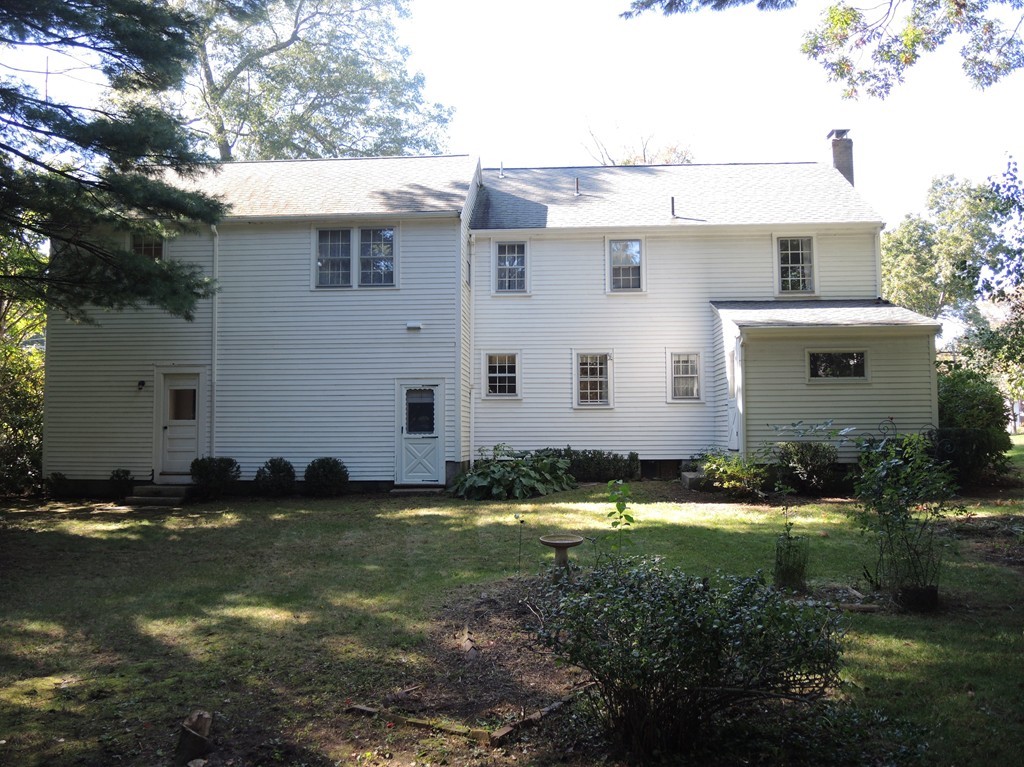 58 Avalon Road Needham, MA 02492 - Photo 2 of 22 a view of a white house with a yard