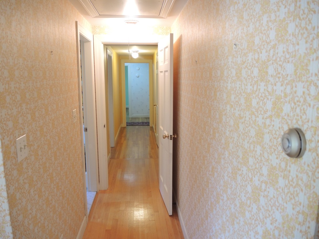 58 Avalon Road Needham, MA 02492 - Photo 21 of 22 a view of a bathroom from a hallway