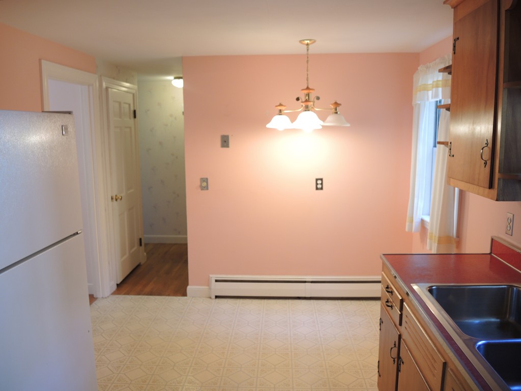 58 Avalon Road Needham, MA 02492 - Photo 22 of 22 a view of a hallway with painted walls