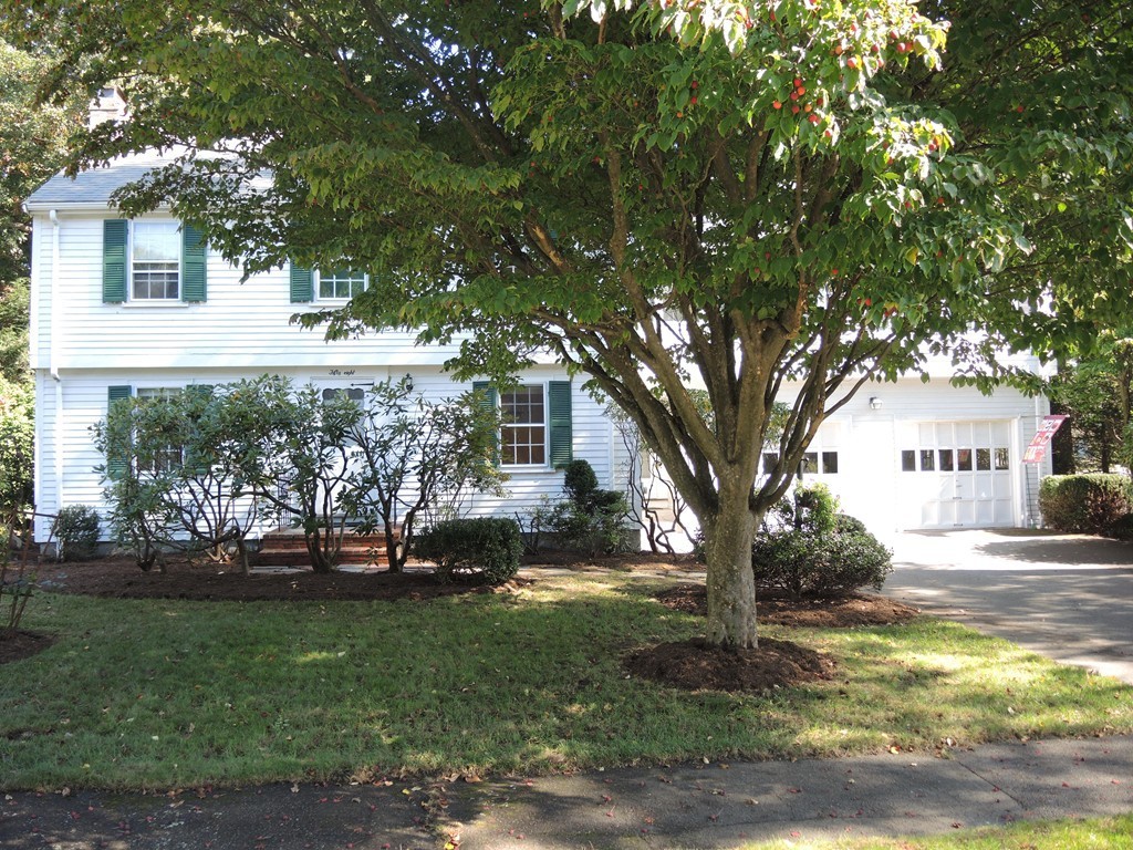 58 Avalon Road Needham, MA 02492 - Photo 3 of 22 a front view of a house with a yard
