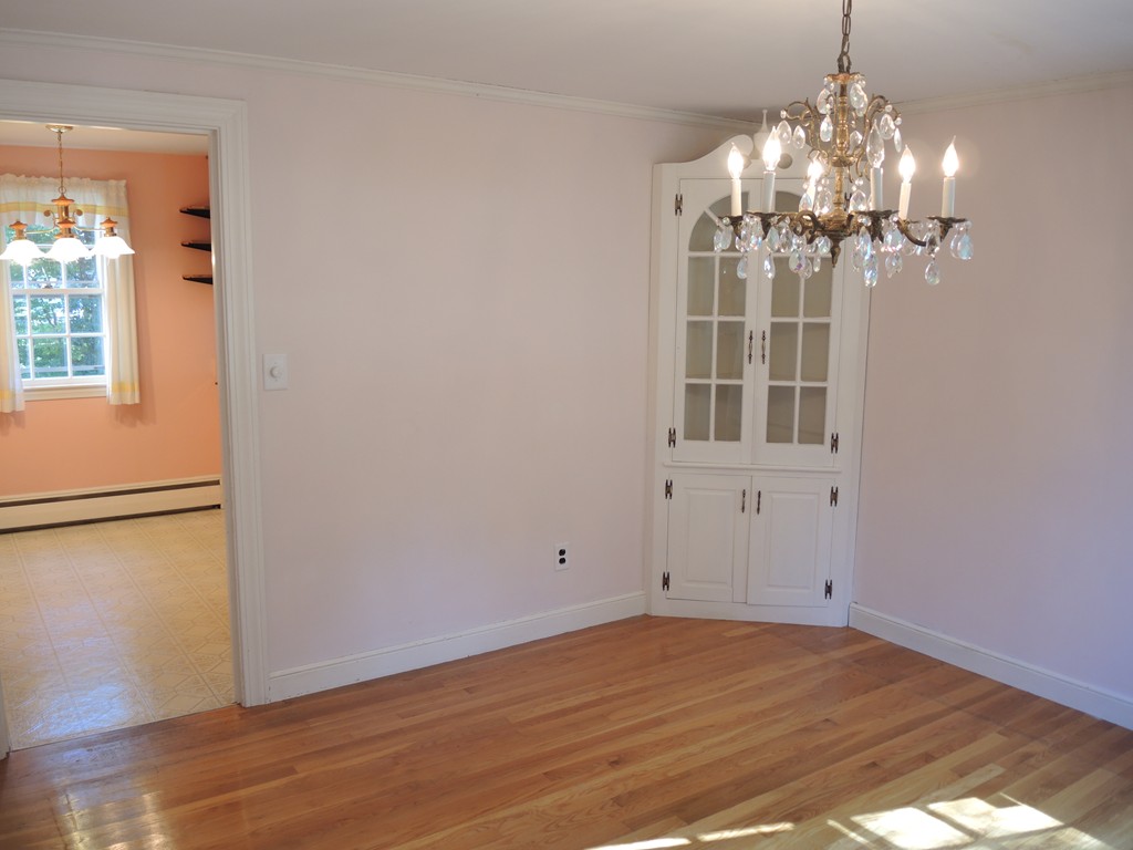 58 Avalon Road Needham, MA 02492 - Photo 6 of 22 a view of a livingroom with a chandelier fan and wooden floor
