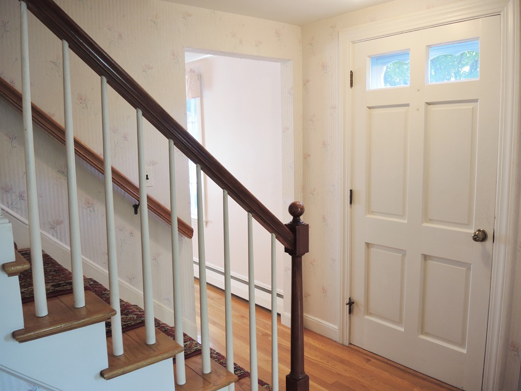 58 Avalon Road Needham, MA 02492 - Photo 7 of 22 a view of an entryway with wooden floor and door