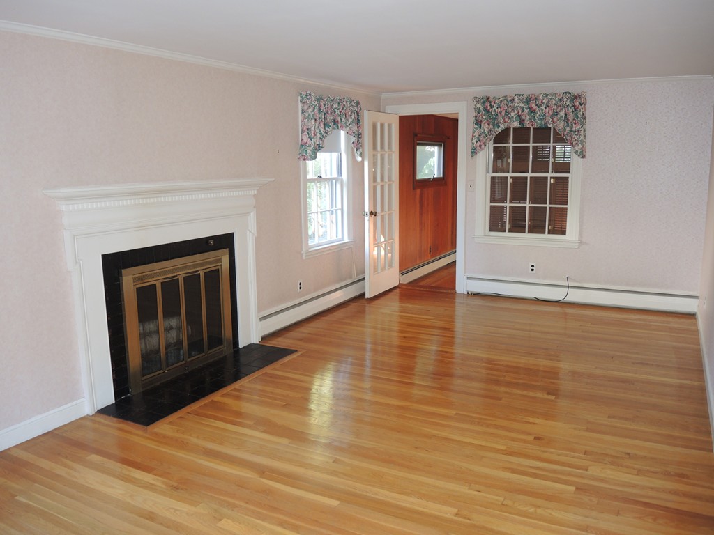 58 Avalon Road Needham, MA 02492 - Photo 8 of 22 wooden floor fireplace and windows in an empty room