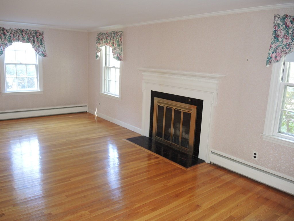 58 Avalon Road Needham, MA 02492 - Photo 9 of 22 an empty room with wooden floor cabinet and windows