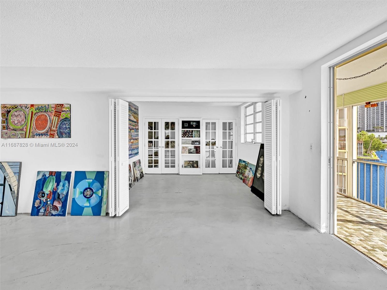 2980 Point E Drive, Unit D508 Aventura, FL 33160 - Photo 12 of 53 a view of a livingroom with a large window and living room