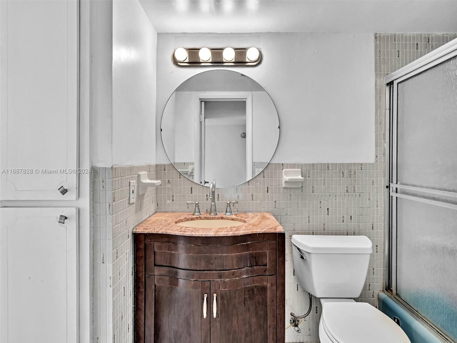 2980 Point E Drive, Unit D508 Aventura, FL 33160 - Photo 20 of 53 a bathroom with a toilet sink and mirror