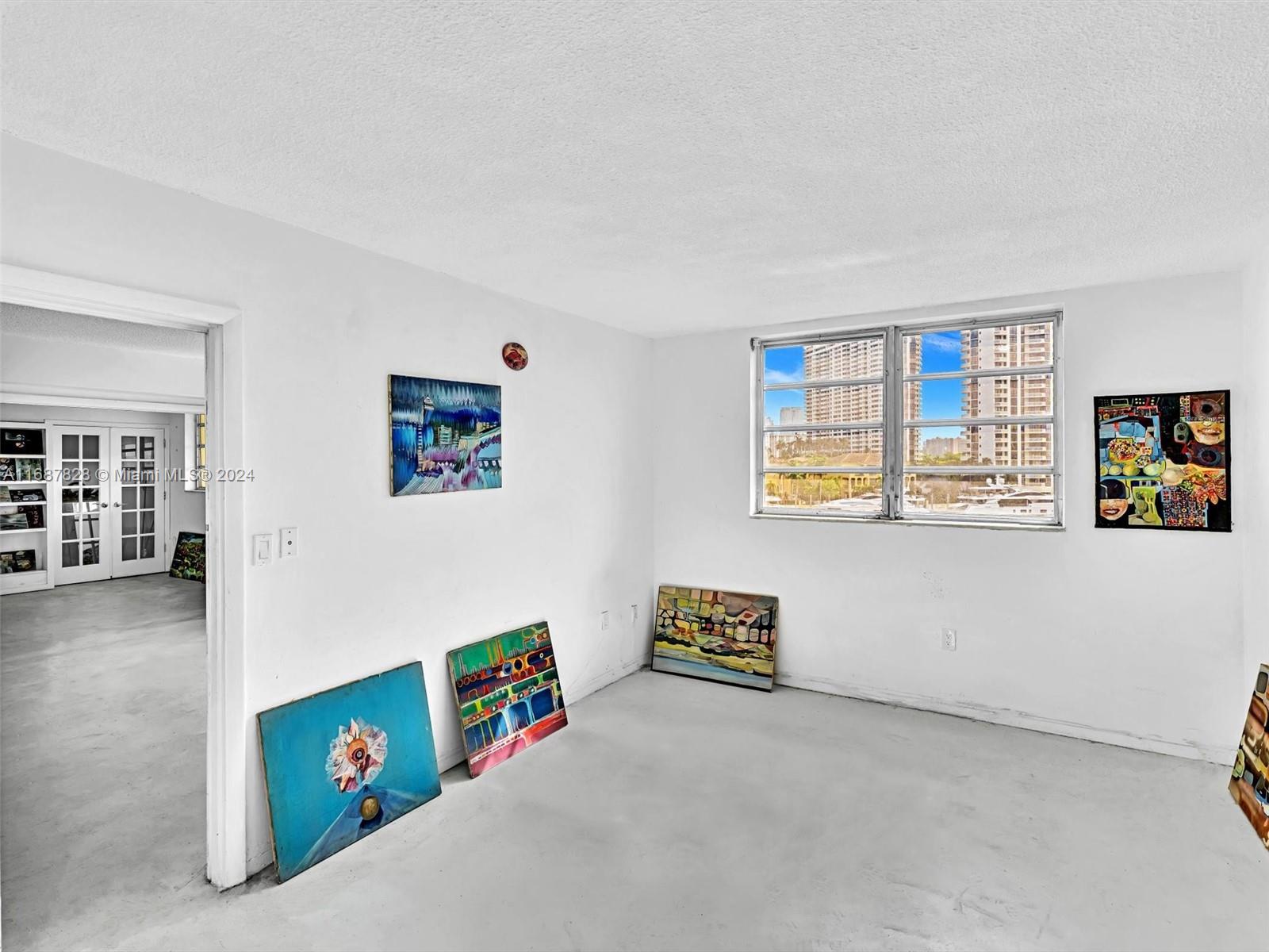 2980 Point E Drive, Unit D508 Aventura, FL 33160 - Photo 21 of 53 a living room with furniture and a window