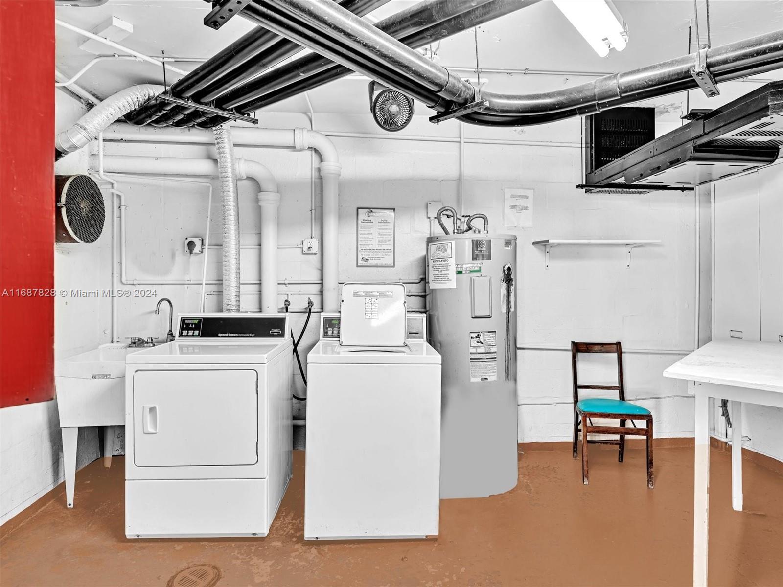2980 Point E Drive, Unit D508 Aventura, FL 33160 - Photo 26 of 53 a utility room with dryer and washer