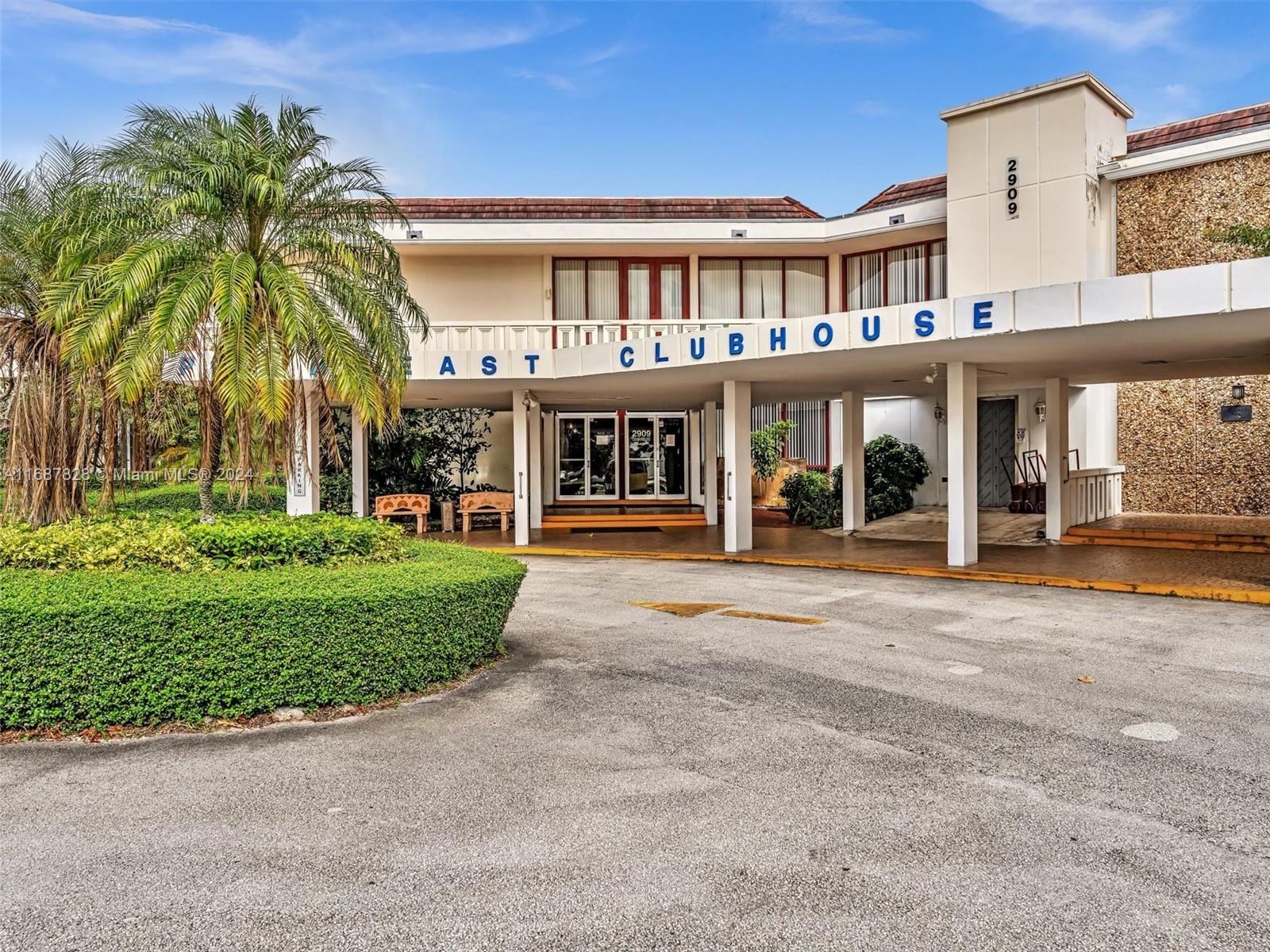 2980 Point E Drive, Unit D508 Aventura, FL 33160 - Photo 30 of 53 front view of a building with a garden