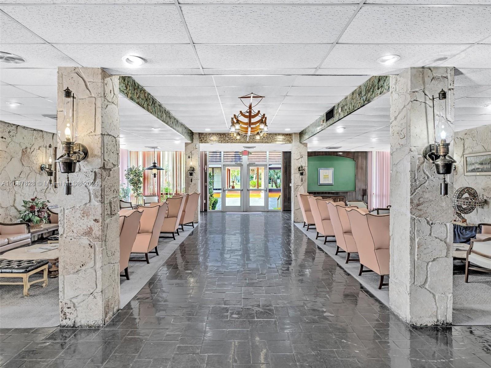 2980 Point E Drive, Unit D508 Aventura, FL 33160 - Photo 32 of 53 a view of a room with lots of furniture and a chandelier