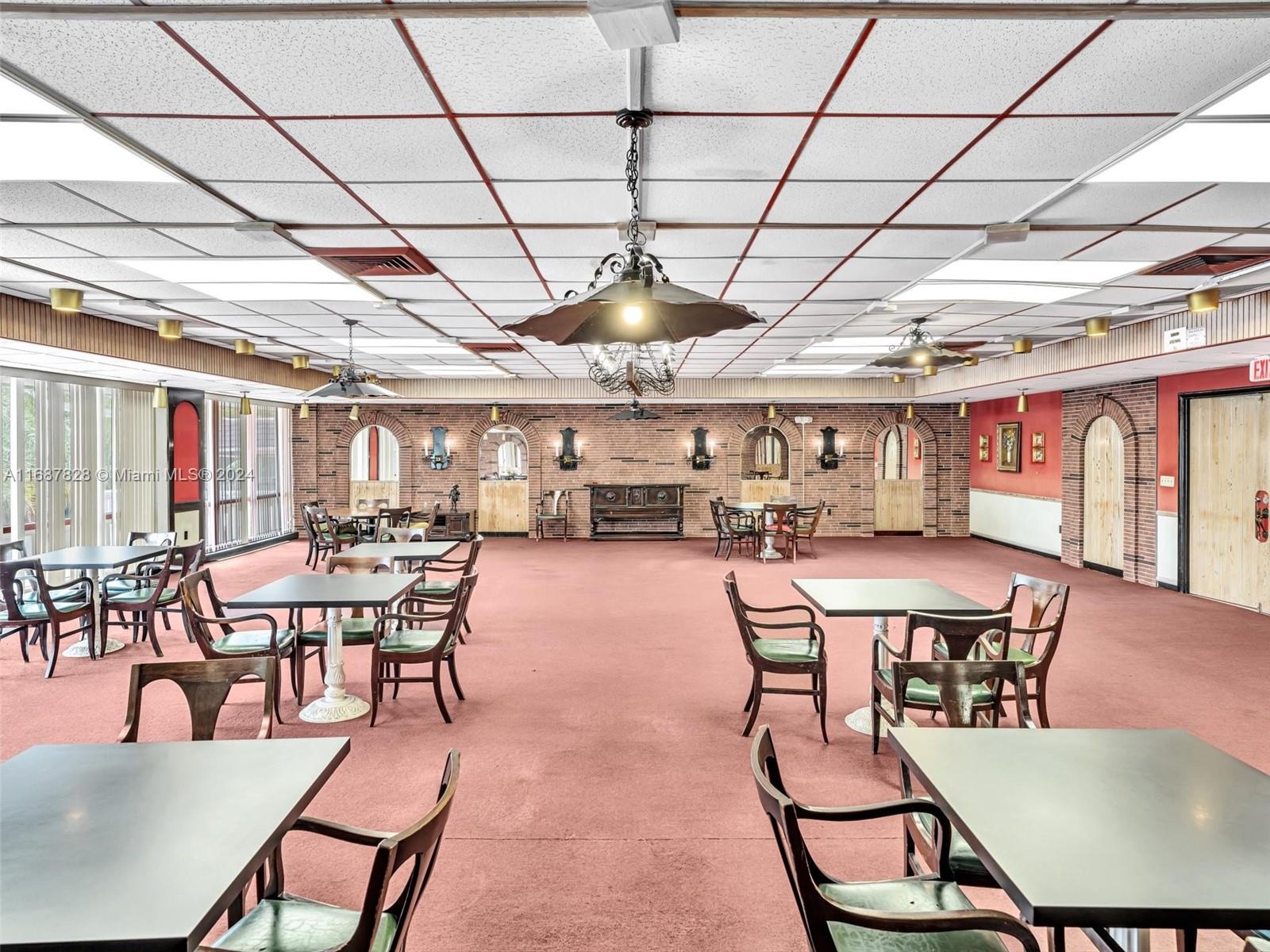 2980 Point E Drive, Unit D508 Aventura, FL 33160 - Photo 36 of 53 a dining room with furniture a rug and a chandelier