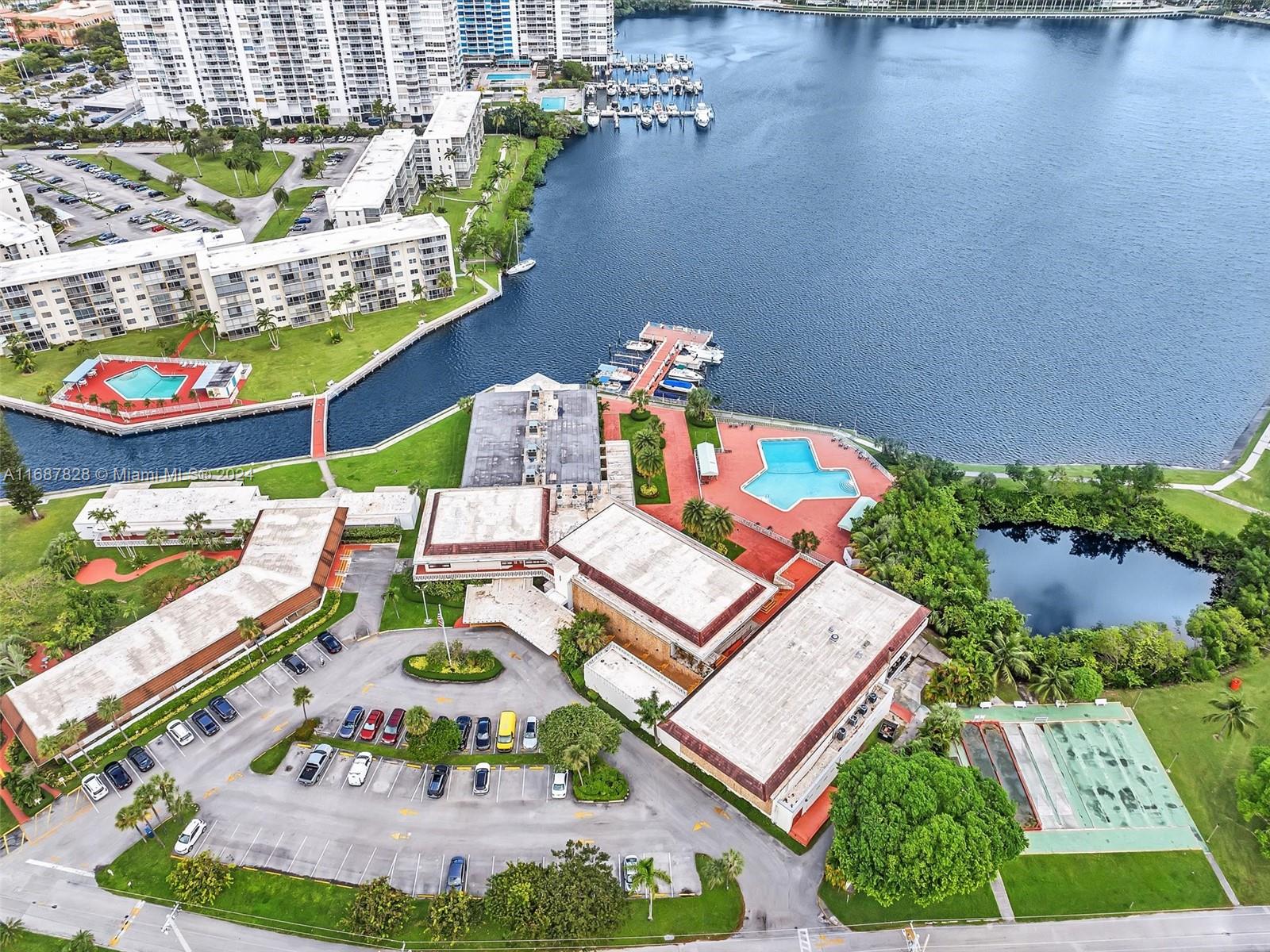 2980 Point E Drive, Unit D508 Aventura, FL 33160 - Photo 48 of 53 an aerial view of a dining table and chairs with an umbrella