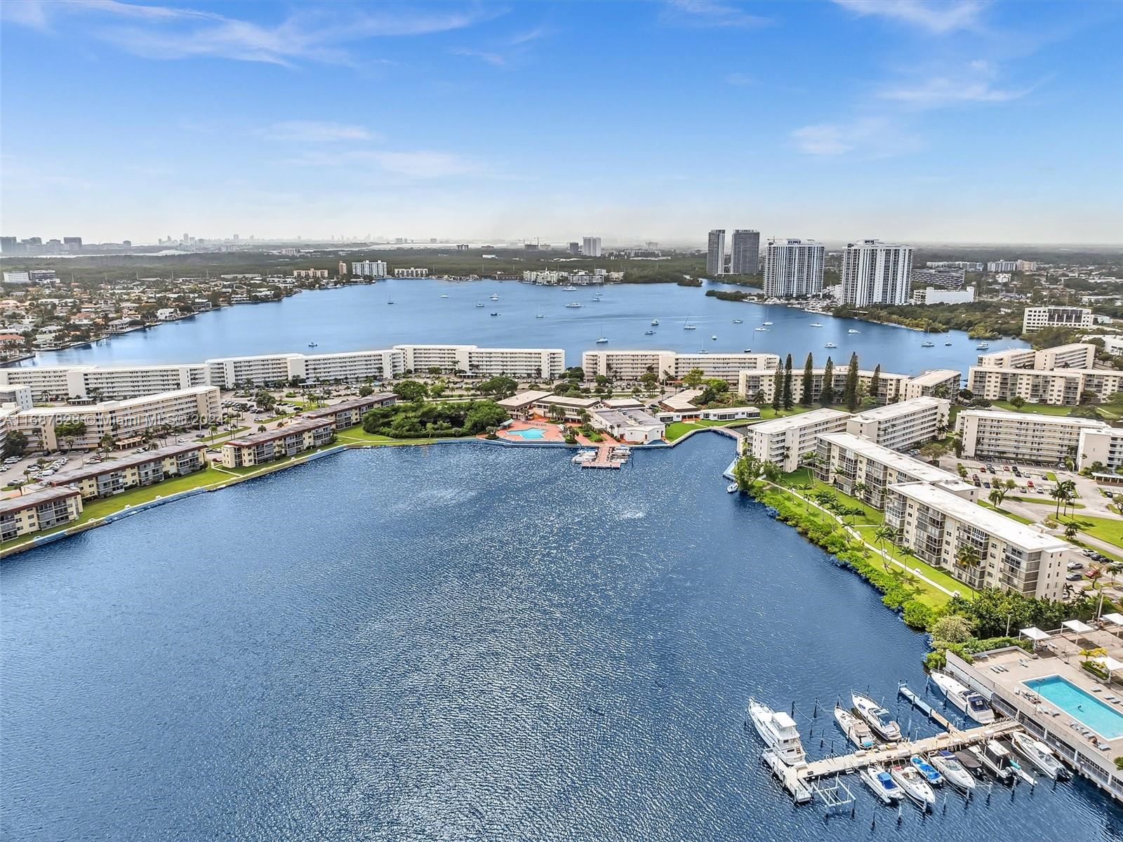 2980 Point E Drive, Unit D508 Aventura, FL 33160 - Photo 51 of 53 an aerial view of a city with lawn chairs