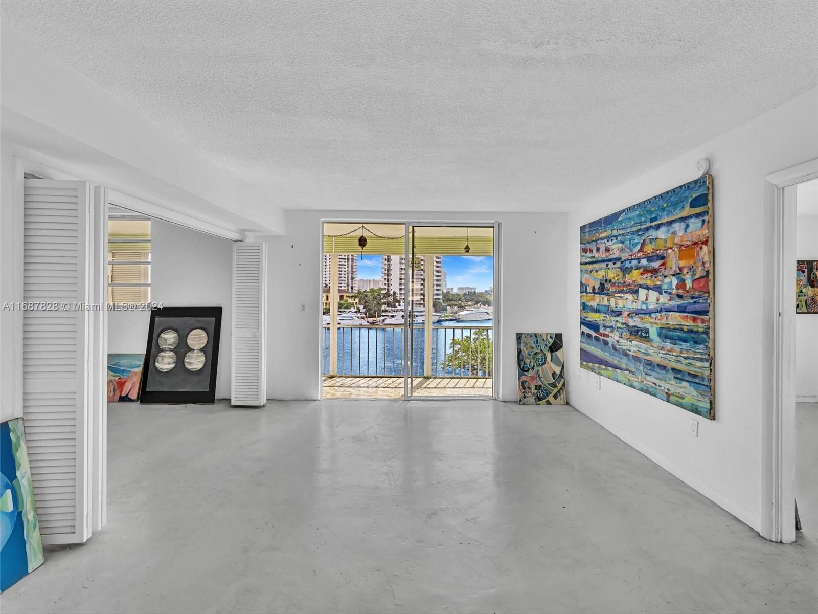 2980 Point E Drive, Unit D508 Aventura, FL 33160 - Photo 6 of 53 a view of an empty room with a window